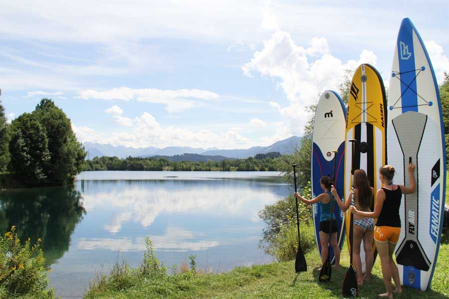 Mit den SUP Boards von Mistral, Fanatic und Naish auf einen schönen See