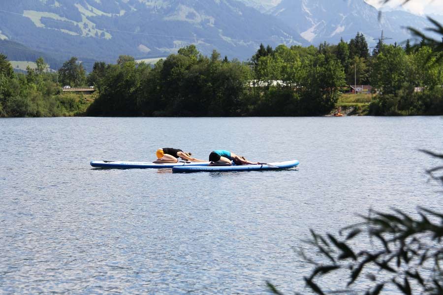 SUP Yoga Kurs, mit dem SUP auf dem See